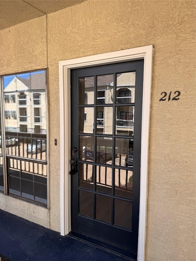 4800 W Lovers Ln Unit 212, Dallas, TX 75209 - doorway to property featuring stucco siding