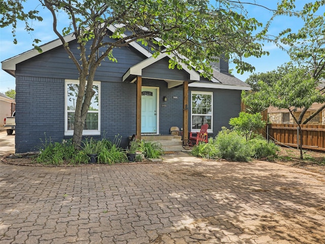 2522 W Jefferson Blvd, Dallas, TX 75211 - view of front of home with brick siding and a chimney