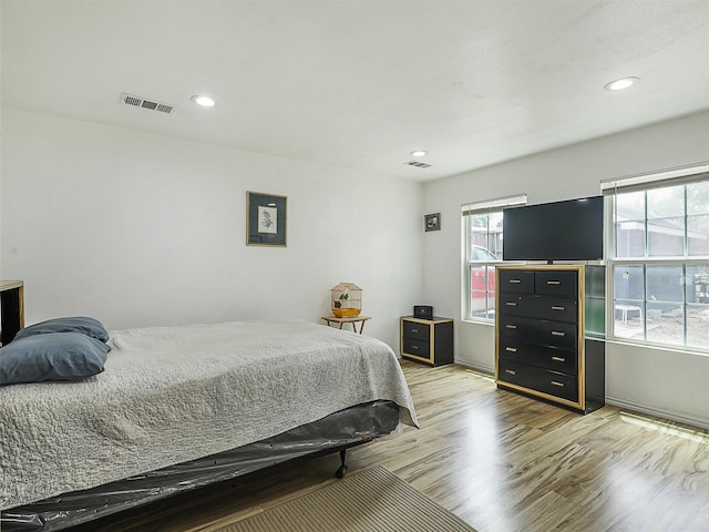 2522 W Jefferson Blvd, Dallas, TX 75211 - bedroom featuring wood finished floors, recessed lighting, and baseboards