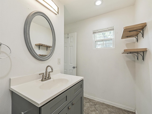 2522 W Jefferson Blvd, Dallas, TX 75211 - bathroom with vanity, tile patterned floors, baseboards, and recessed lighting