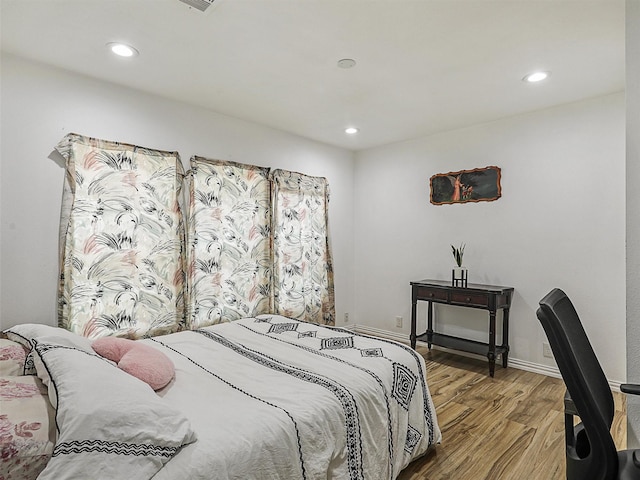 2522 W Jefferson Blvd, Dallas, TX 75211 - bedroom with wood finished floors, recessed lighting, and baseboards