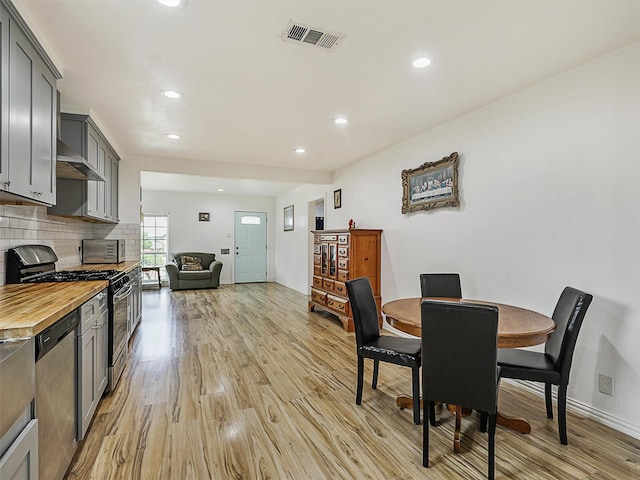 2522 W Jefferson Blvd, Dallas, TX 75211 - dining space featuring light wood-style flooring, recessed lighting, and baseboards