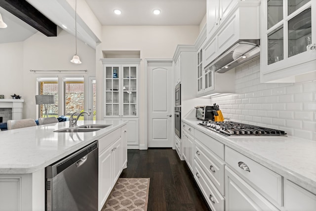2712 Cross Oak Pl, Mckinney, TX 75071 - kitchen with appliances with stainless steel finishes, backsplash, a sink, white cabinets, and light stone counters