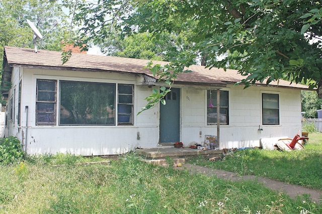 601 S Colorado St, Whitney, TX 76692 - view of front facade with a chimney, roof with shingles, and a front lawn