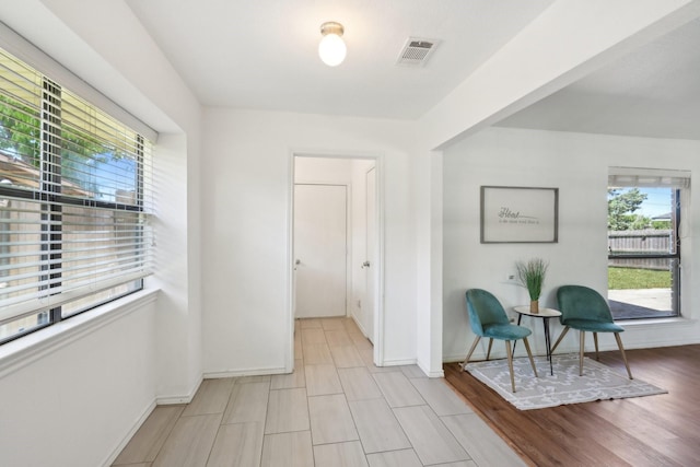 6319 Leasa Ct, Sachse, TX 75048 - living area featuring plenty of natural light and baseboards