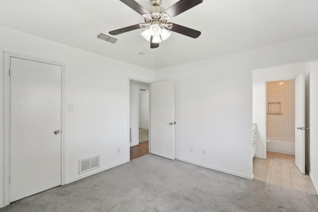 6319 Leasa Ct, Sachse, TX 75048 - unfurnished bedroom featuring light colored carpet, ensuite bath, ceiling fan, and baseboards