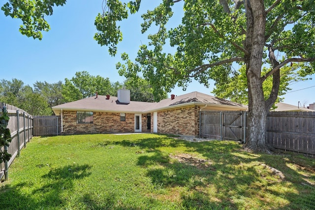 6319 Leasa Ct, Sachse, TX 75048 - rear view of property with brick siding and a gate