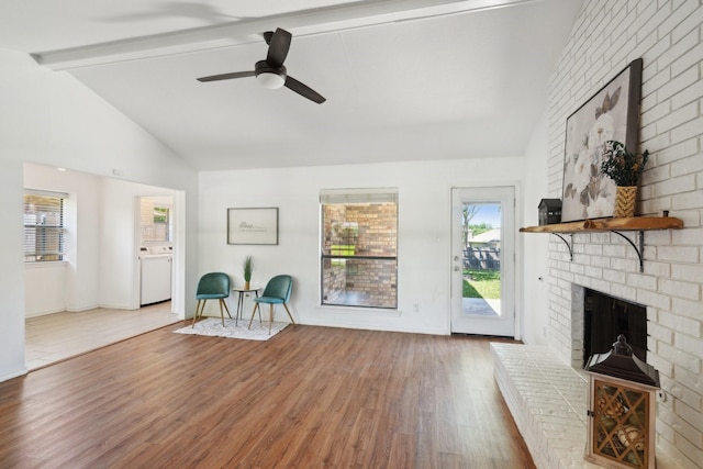 6319 Leasa Ct, Sachse, TX 75048 - unfurnished room featuring a fireplace, wood finished floors, healthy amount of natural light, and ceiling fan