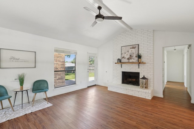 6319 Leasa Ct, Sachse, TX 75048 - living room featuring ceiling fan, wood finished floors, a brick fireplace, and baseboards