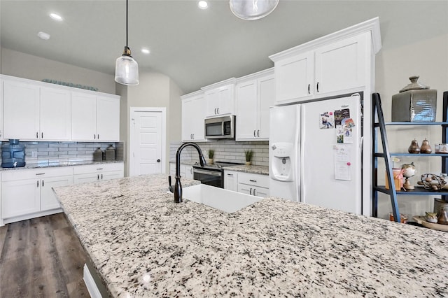 4817 Enclave Dr, Sanger, TX 76266 - kitchen with stainless steel appliances, tasteful backsplash, white cabinetry, dark wood finished floors, and light stone countertops