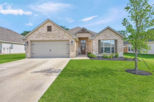 4817 Enclave Dr, Sanger, TX 76266 - view of front of house featuring an attached garage, driveway, brick siding, and a front lawn