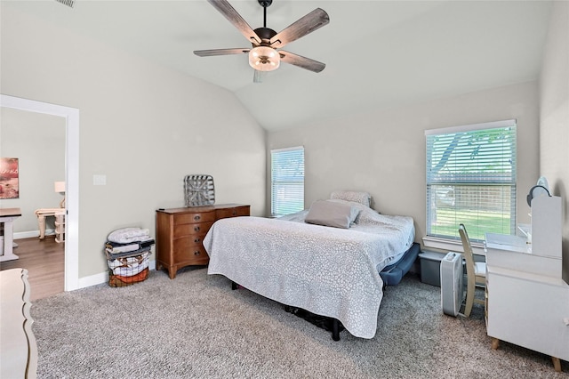 4817 Enclave Dr, Sanger, TX 76266 - bedroom with multiple windows, vaulted ceiling, carpet flooring, ceiling fan, and baseboards