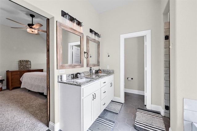 4817 Enclave Dr, Sanger, TX 76266 - ensuite bathroom featuring double vanity, ceiling fan, baseboards, and tile patterned floors