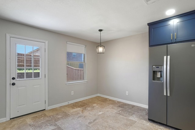 3804 Kathryn Way, Mckinney, TX 75070 - unfurnished dining area with baseboards and light stone finish flooring