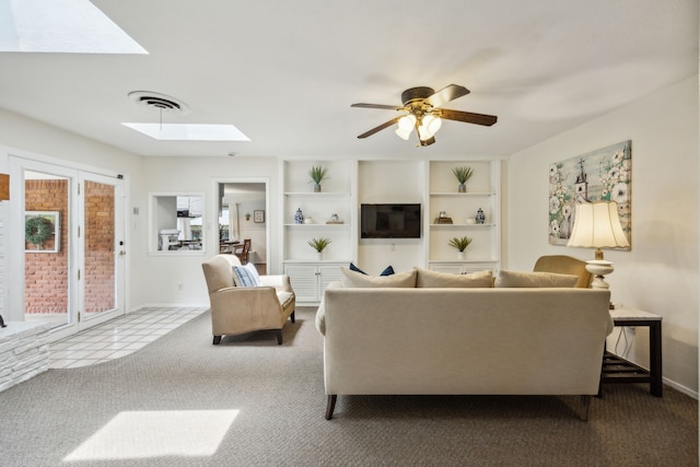 4309 Bilglade Rd, Fort Worth, TX 76109 - living room featuring a skylight, carpet, baseboards, and a ceiling fan