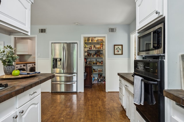 4309 Bilglade Rd, Fort Worth, TX 76109 - kitchen featuring stainless steel appliances, separate washer and dryer, dark wood finished floors, white cabinetry, and wood counters