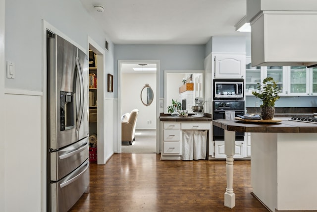 4309 Bilglade Rd, Fort Worth, TX 76109 - kitchen featuring stainless steel appliances, white cabinetry, and dark wood-style floors