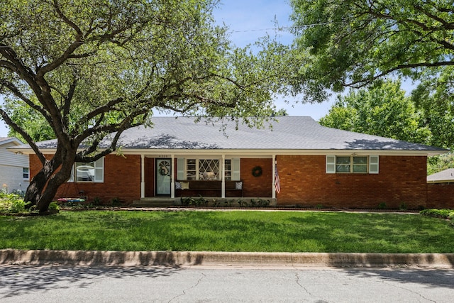 4309 Bilglade Rd, Fort Worth, TX 76109 - ranch-style home featuring brick siding and a front yard