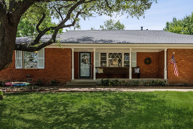 4309 Bilglade Rd, Fort Worth, TX 76109 - single story home with brick siding, a front lawn, and a porch