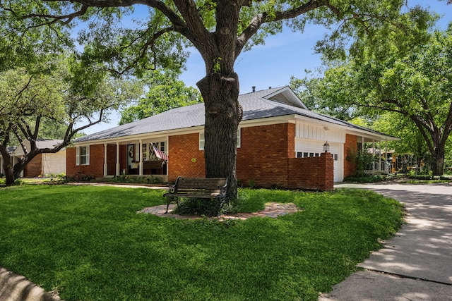 4309 Bilglade Rd, Fort Worth, TX 76109 - ranch-style home featuring brick siding, an attached garage, a front yard, and driveway