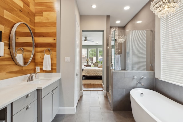 15198 Woodbluff Dr, Frisco, TX 75035 - full bath featuring a freestanding tub, a shower stall, vanity, tile patterned flooring, and recessed lighting