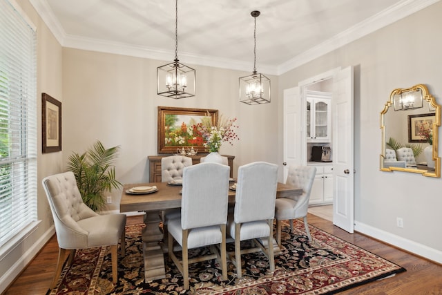 15198 Woodbluff Dr, Frisco, TX 75035 - dining room with a chandelier, wood finished floors, crown molding, and baseboards