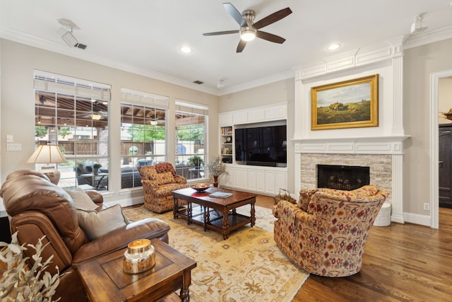 15198 Woodbluff Dr, Frisco, TX 75035 - living area featuring ceiling fan, wood finished floors, crown molding, a fireplace, and recessed lighting