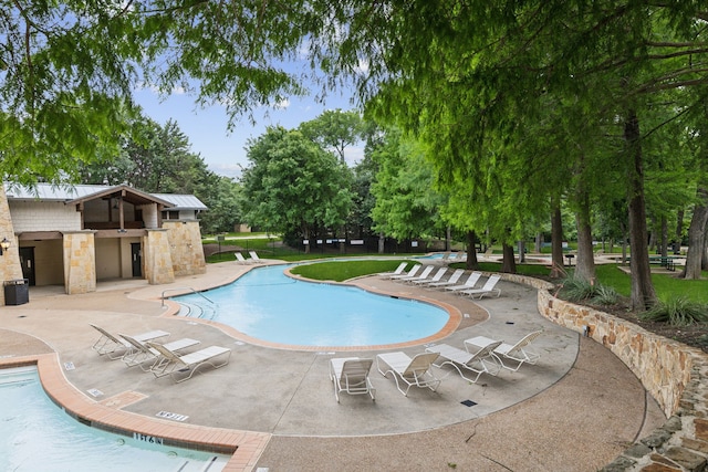15198 Woodbluff Dr, Frisco, TX 75035 - community pool featuring a patio area