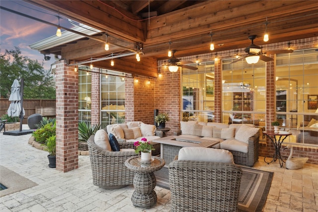 15198 Woodbluff Dr, Frisco, TX 75035 - patio terrace at dusk with an outdoor living space, a patio, and ceiling fan