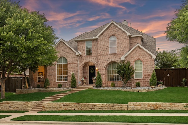 15198 Woodbluff Dr, Frisco, TX 75035 - traditional home with a chimney, brick siding, and a shingled roof