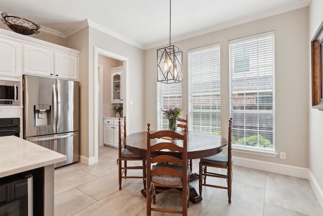 15198 Woodbluff Dr, Frisco, TX 75035 - dining space featuring beverage cooler, ornamental molding, light tile patterned floors, and baseboards