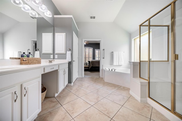 414 Long Cove Dr, Fairview, TX 75069 - bathroom featuring vaulted ceiling, double vanity, ensuite bath, a garden tub, and a stall shower
