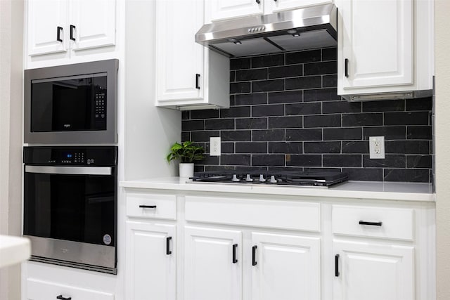414 Long Cove Dr, Fairview, TX 75069 - kitchen with ventilation hood, appliances with stainless steel finishes, decorative backsplash, and white cabinetry