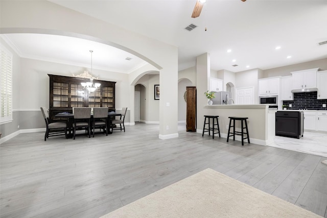 414 Long Cove Dr, Fairview, TX 75069 - dining room with a ceiling fan, light wood-style floors, baseboards, crown molding, and a chandelier