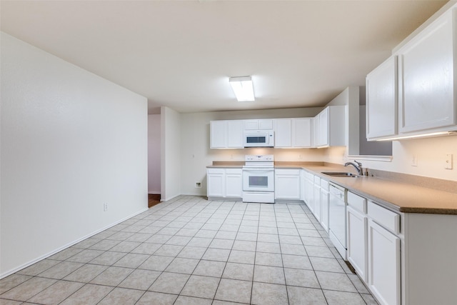 1337 Red River Ln, Allen, TX 75002 - kitchen featuring white appliances, a sink, white cabinetry, light tile patterned floors, and baseboards
