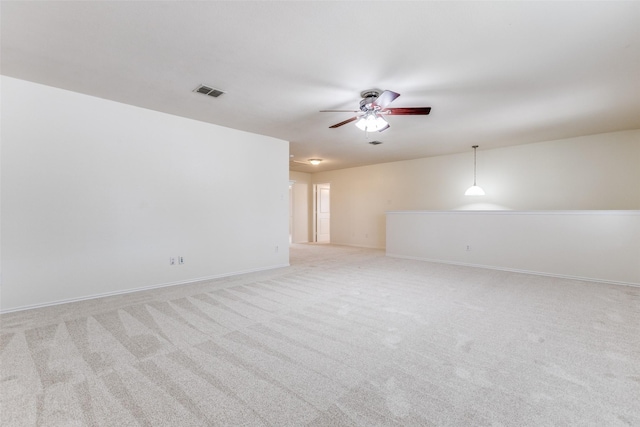 1337 Red River Ln, Allen, TX 75002 - spare room featuring a ceiling fan, light carpet, and baseboards