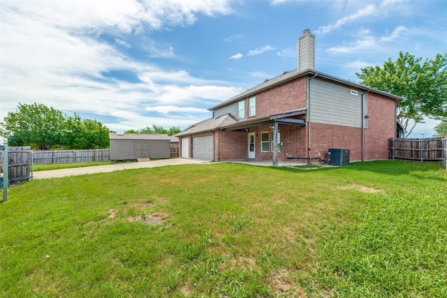 1337 Red River Ln, Allen, TX 75002 - rear view of property with brick siding, driveway, central air condition unit, a garage, and a chimney