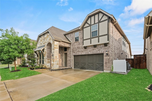 3456 Begonia Ln, Irving, TX 75038 - tudor house featuring a garage, concrete driveway, brick siding, central AC, and roof with shingles