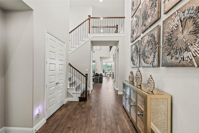 3456 Begonia Ln, Irving, TX 75038 - entrance foyer with wood finished floors, stairway, a high ceiling, and baseboards