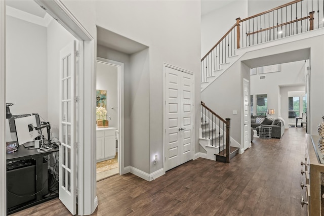 3456 Begonia Ln, Irving, TX 75038 - foyer with stairs, wood finished floors, a high ceiling, and baseboards