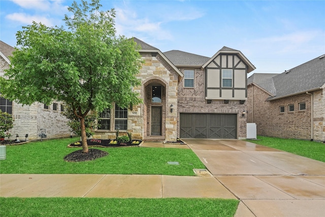 3456 Begonia Ln, Irving, TX 75038 - english style home with a garage, driveway, a front lawn, stone siding, and stucco siding