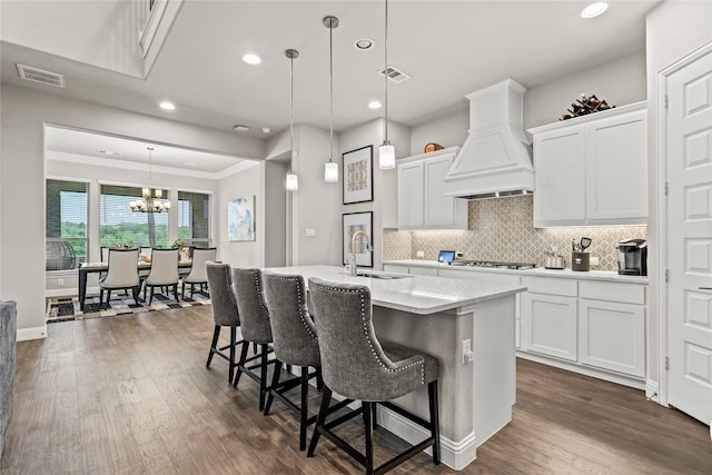 3456 Begonia Ln, Irving, TX 75038 - kitchen featuring premium range hood, recessed lighting, light countertops, dark wood-type flooring, and decorative backsplash