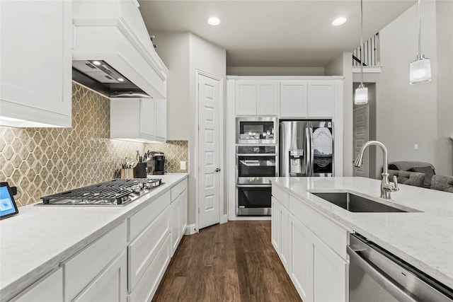 3456 Begonia Ln, Irving, TX 75038 - kitchen with stainless steel appliances, a sink, custom range hood, dark wood-type flooring, and white cabinetry