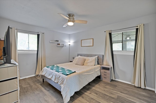 1429 W Water St, Weatherford, TX 76086 - bedroom featuring wood finished floors, a ceiling fan, and baseboards