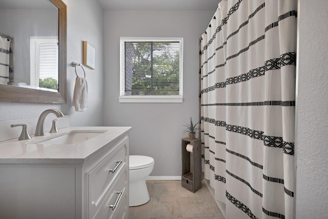 1429 W Water St, Weatherford, TX 76086 - full bath featuring vanity, toilet, a shower with shower curtain, and baseboards