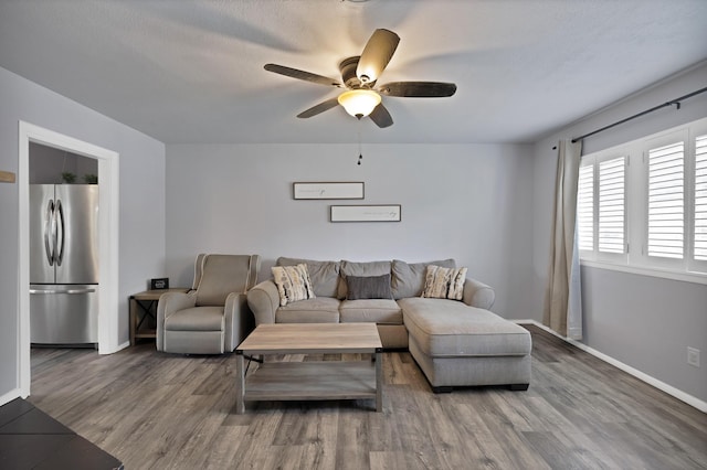 1429 W Water St, Weatherford, TX 76086 - living room featuring ceiling fan, wood finished floors, and baseboards