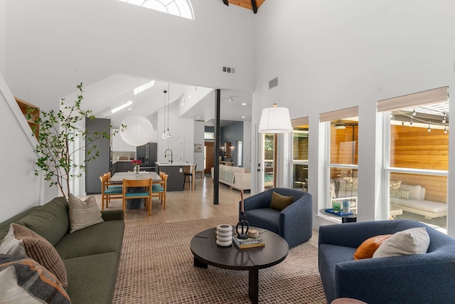 4005 Province Dr, Carrollton, TX 75007 - living room featuring light wood-type flooring and a towering ceiling