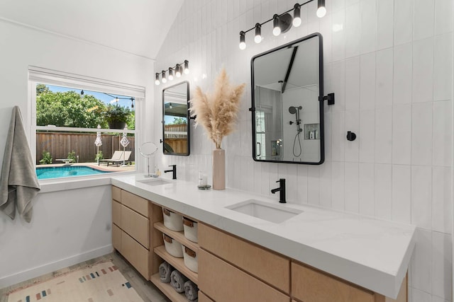 4005 Province Dr, Carrollton, TX 75007 - full bathroom featuring double vanity, lofted ceiling, and tiled shower