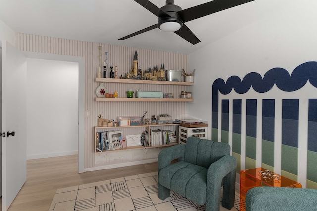 4005 Province Dr, Carrollton, TX 75007 - living area featuring wood finished floors, a ceiling fan, and baseboards