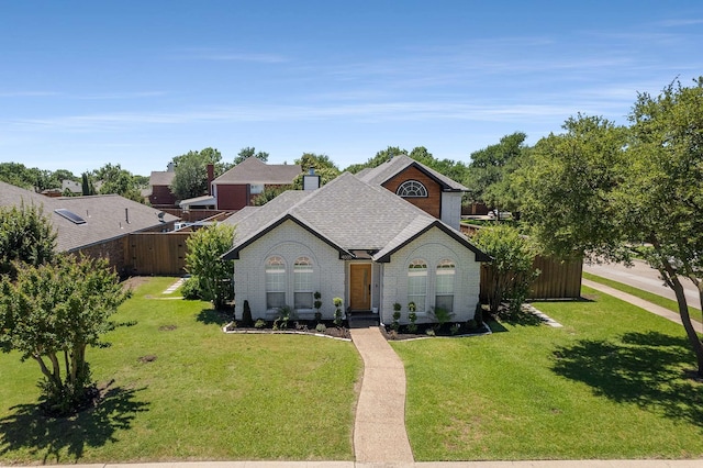 4005 Province Dr, Carrollton, TX 75007 - french country style house with brick siding, roof with shingles, and a chimney